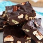 Titled Pinterest image of a pile of keto rocky road fudge on a white plate over a blue patterned napkin.