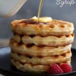 Titled Pinterest image of a small pitcher pouring sugar free maple syrup over a stack of waffles.