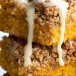 Titled Pinterest image close up of keto pumpkin crumb bars with vanilla drizzle.