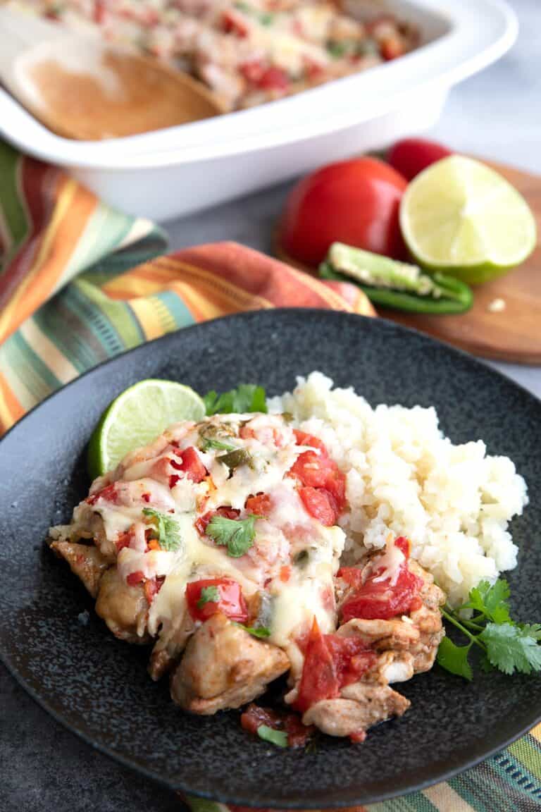 Salsa Fresca Chicken on a black plate with cauliflower rice.