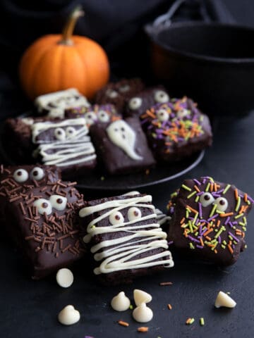 Keto brownies decorated with chocolate eyeballs and Halloween sprinkles.