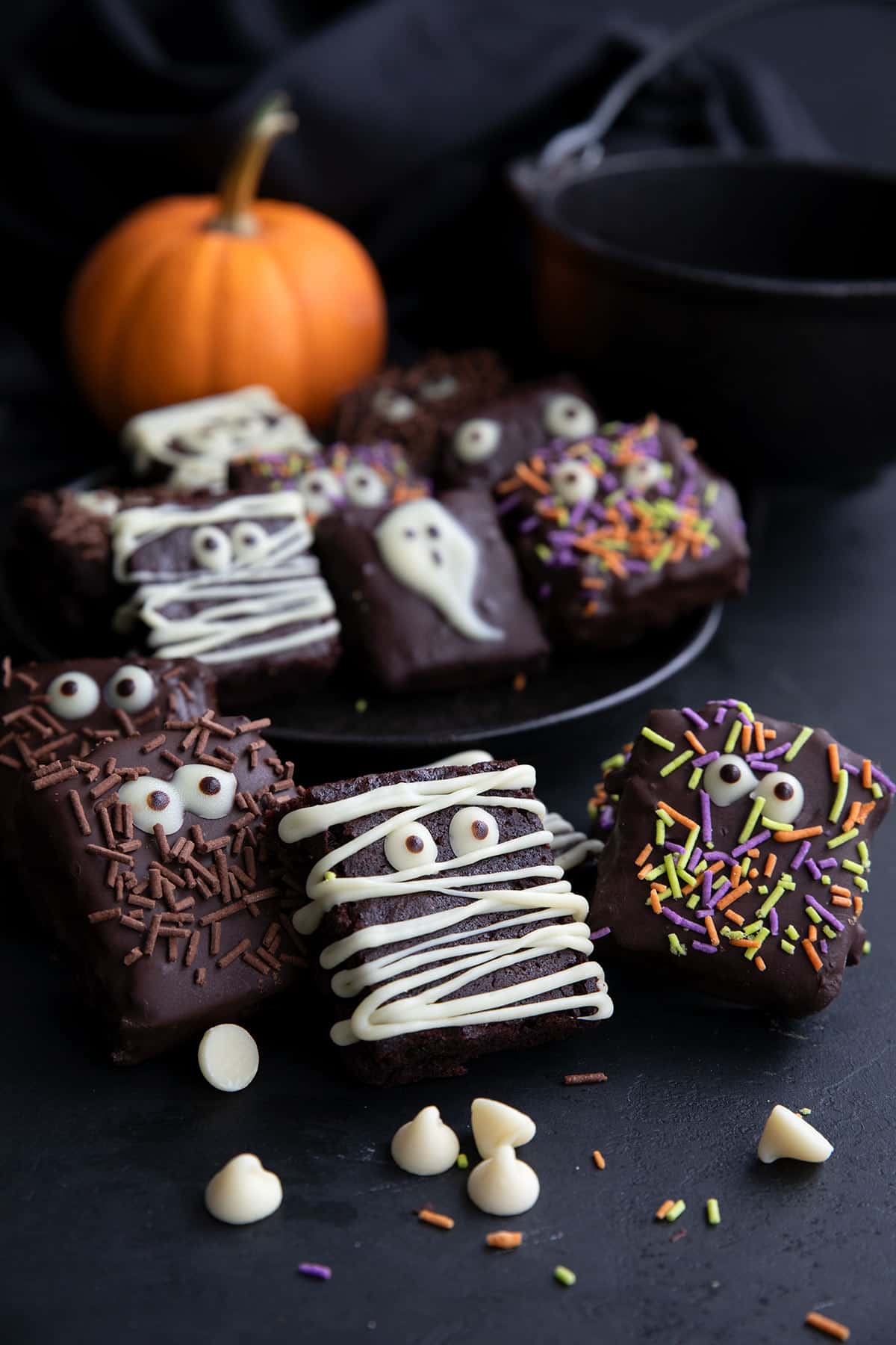 Keto brownies decorated with chocolate eyeballs and Halloween sprinkles.