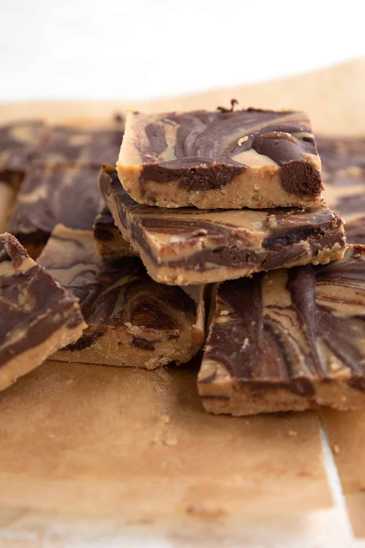 Keto Tiger Butter Bark cut into squares on a piece of parchment paper.