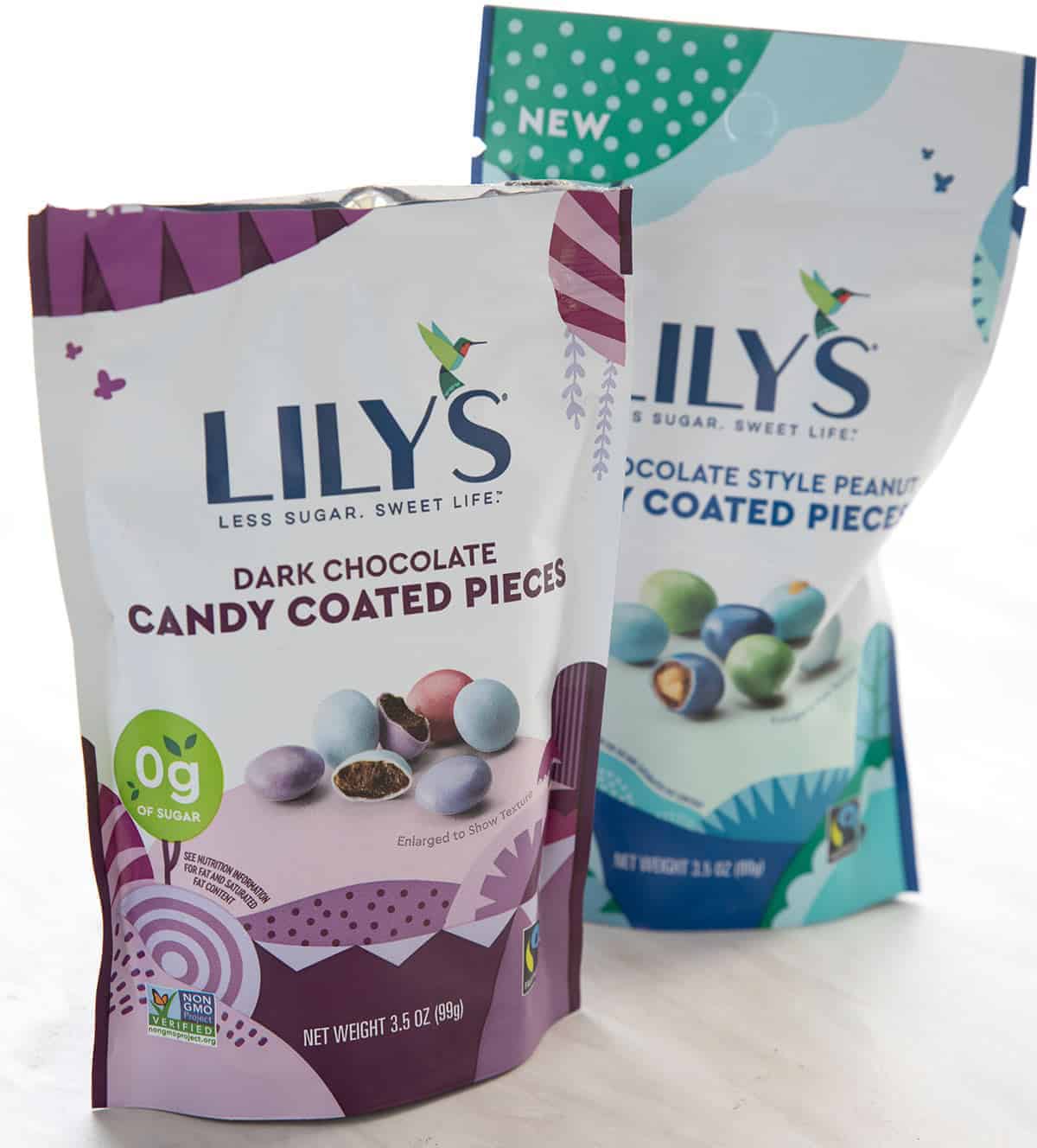 Two bags of Lily's candy coated chocolate pieces.