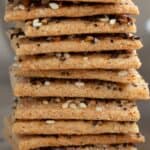 Close up shot of a stack of crispy keto crackers with the title across the top.