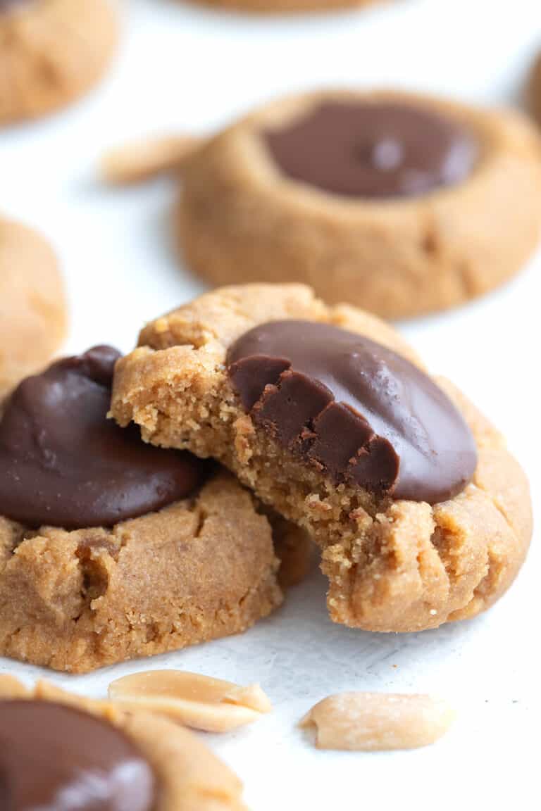 Close up shot of a Keto Peanut Blossoms with a bite taken out of it.