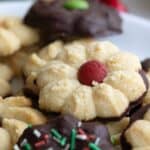 Titled image for Keto Spritz Cookies, piled up on a white plate.