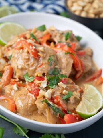 Close up shot of Thai Peanut Chicken in a white oval dish.