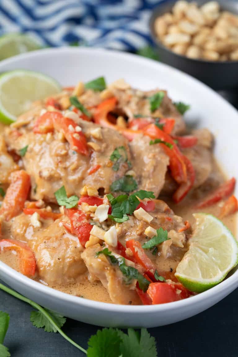 Close up shot of Thai Peanut Chicken in a white oval dish.