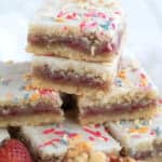 A stack of keto pop tart bars close up on a white wooden table.