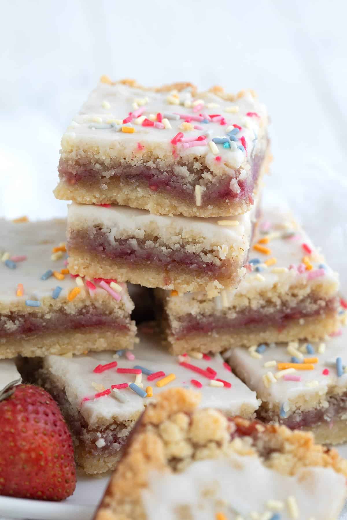 A stack of keto pop tart bars close up on a white wooden table.