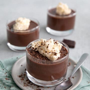 Sugar Free Chocolate Pudding in little glass cups on a concrete table.