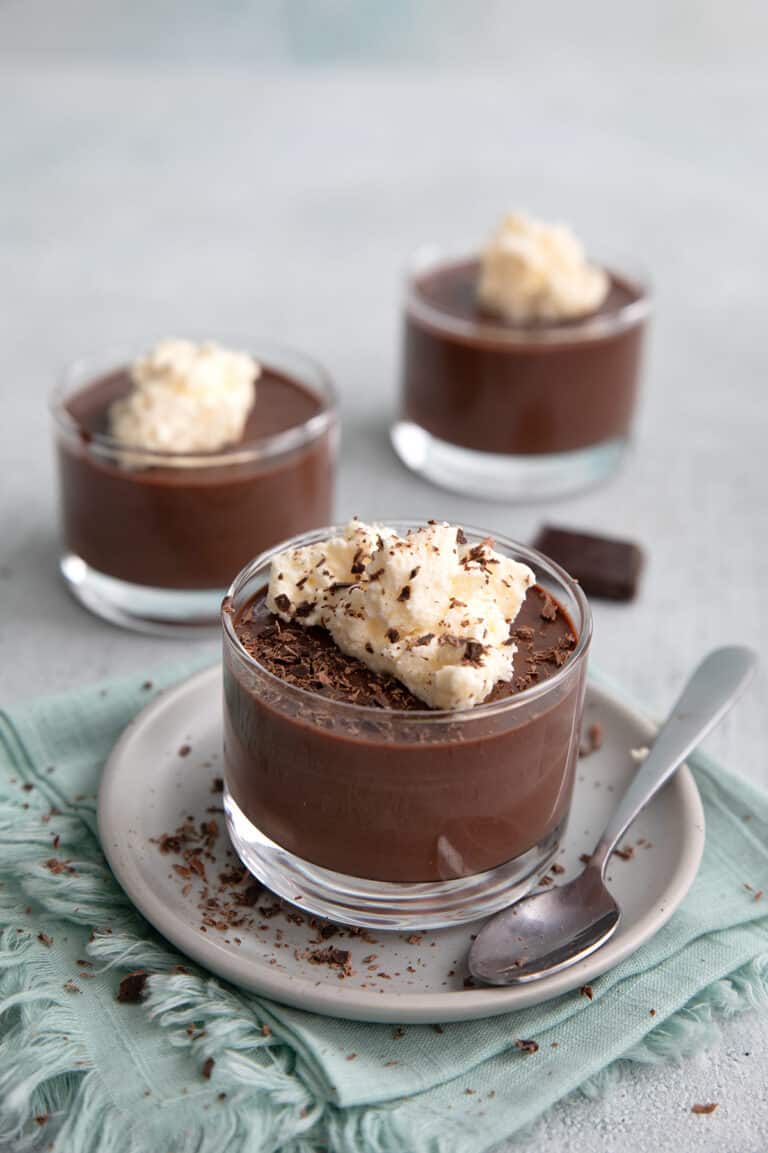 Sugar Free Chocolate Pudding in little glass cups on a concrete table.