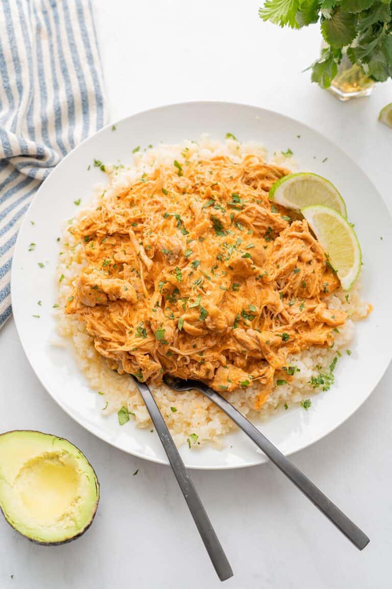 Keto Salsa Chicken on a bed of cauliflower rice in a white bowl.