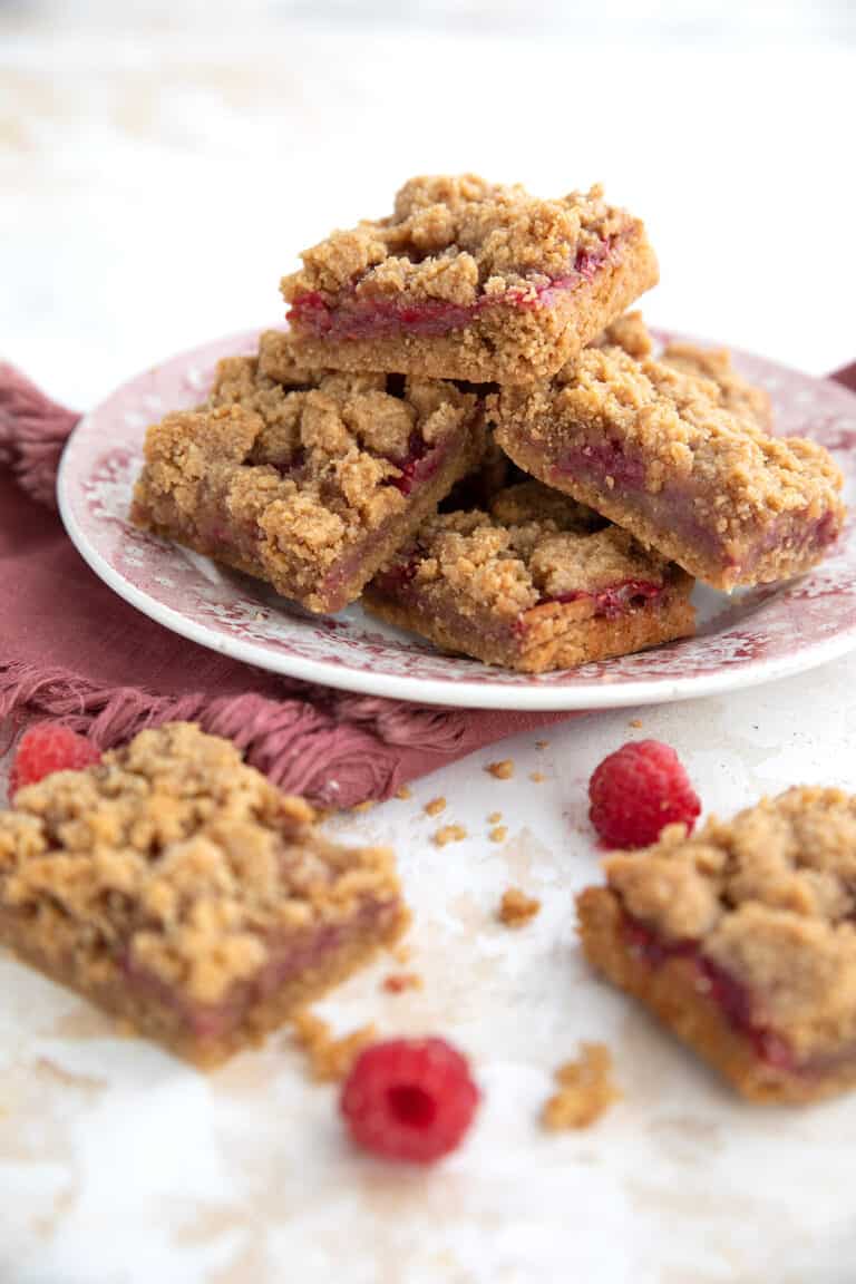 Keto Peanut Butter and Jam Bars on a red patterned plate over a red napkin.