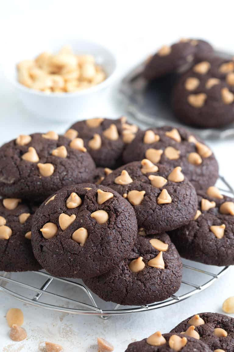 A pile of Keto Chocolate Cookies on a cooling rack.