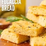 Titled Pinterest image of a stack of keto focaccia bread on a wooden plate.
