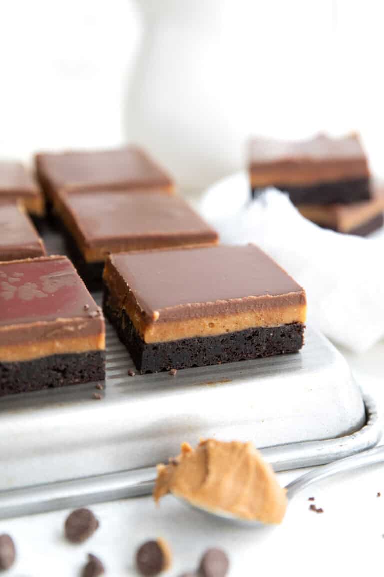 Keto Peanut Butter Fudge Brownies lined up on a baking tray.