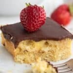 Titled image of a piece of Boston Cream Poke Cake on a white plate with a forkful taken out of it.