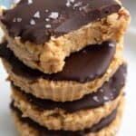 A stack of keto protein bites made with granola, peanut butter, and chocolate.