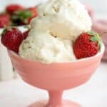 Titled Pinterest image of keto ice cream and fresh strawberries in a pink dish.