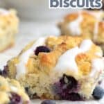 Sweet Keto Blueberry Biscuits on a white piece of parchment paper.