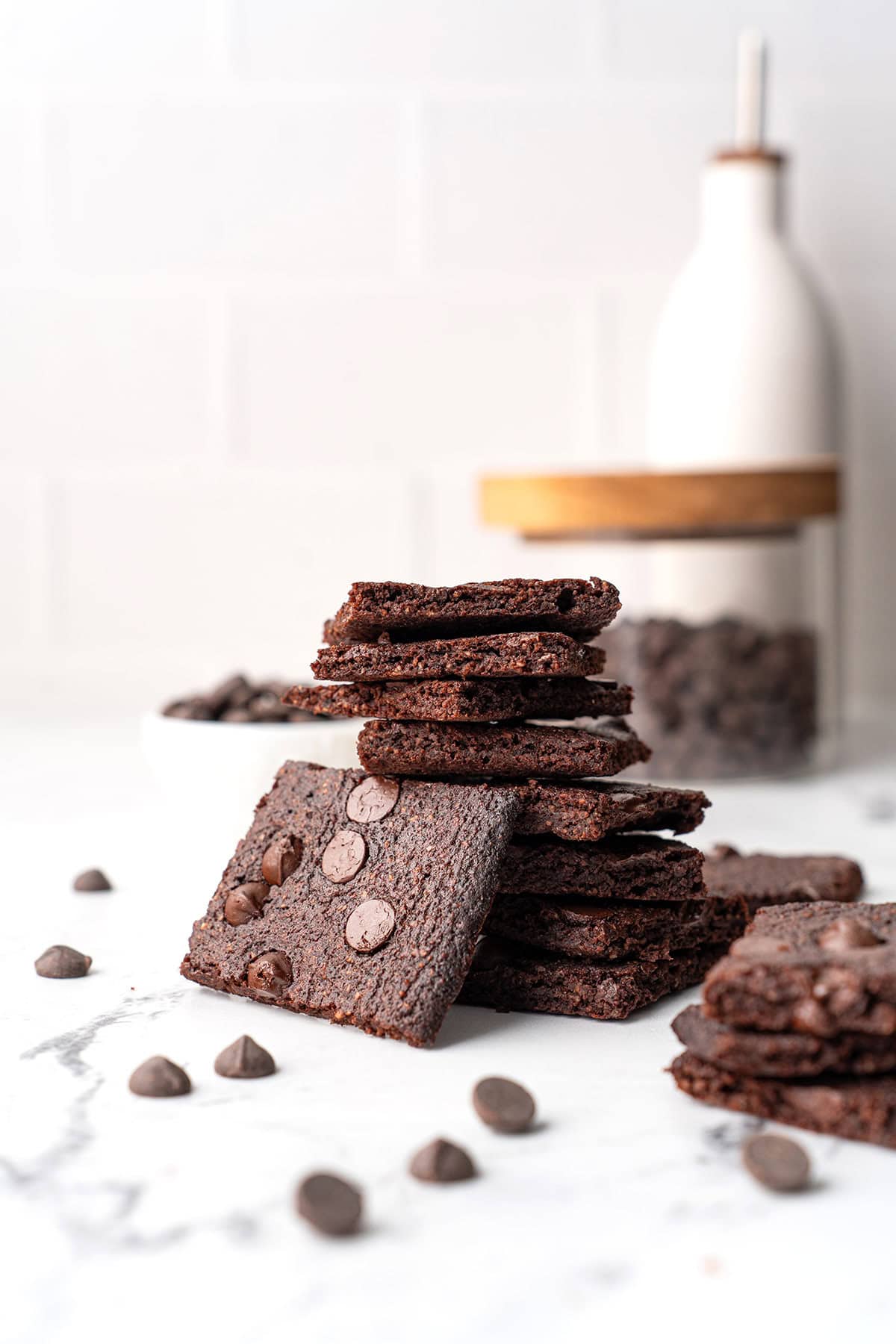 Keto Brownie Bark piled up on a marble table.