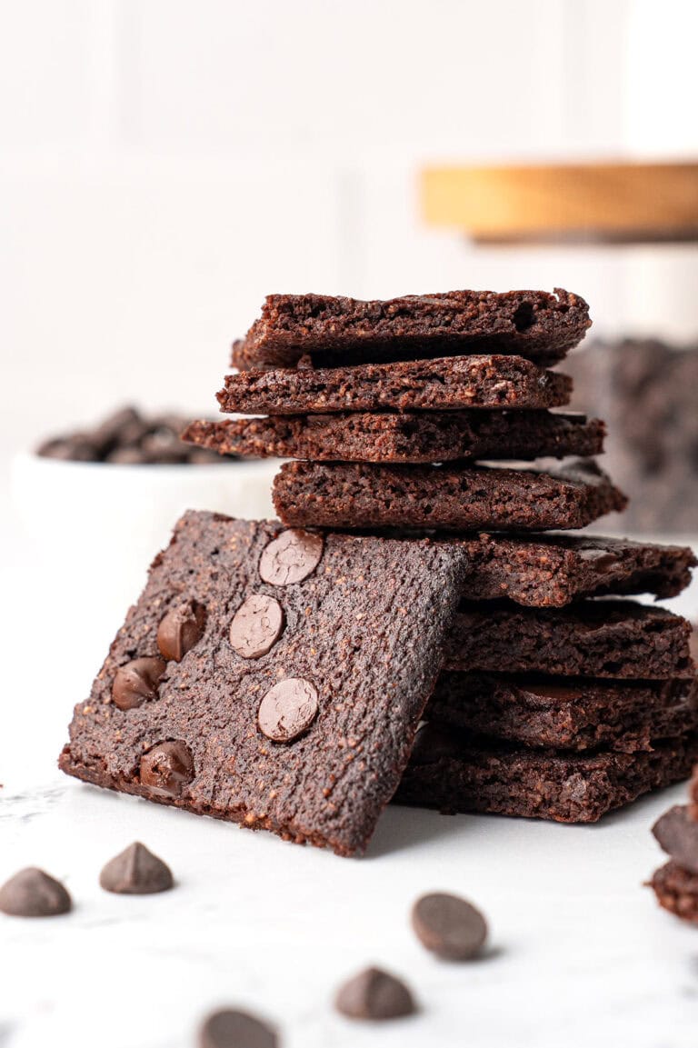 Close up shot of a stack of Keto Brownie Bark on a marble tabletop.