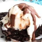 Titled image of a slice of slow cooker chocolate cake with ice cream and chocolate sauce on top.