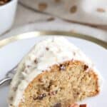 Titled image of a slice of Keto Butter Pecan Pound Cake on a white plate.