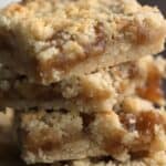 Titled image of a close up stack of Keto Caramel Butter Bars.