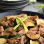 Pinterest image of Chicken Zucchini Stir Fry in a black bowl.