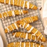 Titled image of Keto Pumpkin Biscotti on a cooling rack.