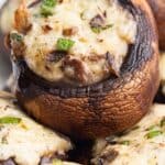 Titled pinterest image close up shot of keto stuffed mushrooms.