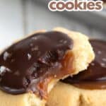 Titled Pinterest image of two Keto Twix Cookies close up, with a bite taken out of one.