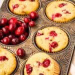 Titled image of keto cranberry pecan muffins in a muffin tin.