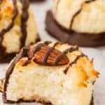 Titled image of Keto Almond Joy Macaroons on a wire cooling rack covered with white parchment paper.