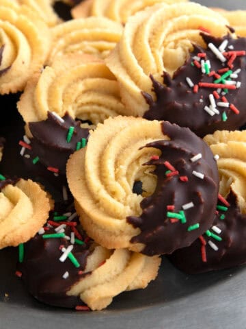 Close up shot of Keto Butter Cookies piled up on a pewter plate.