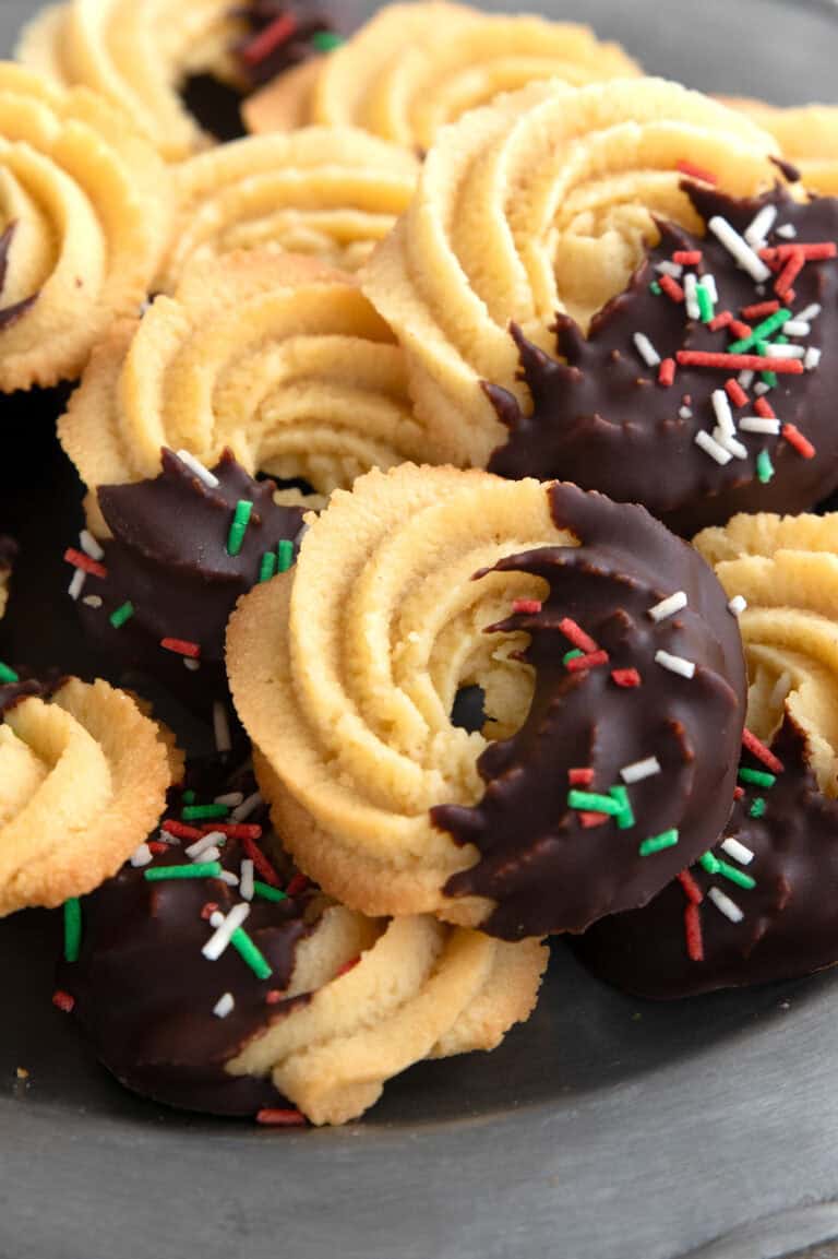 Close up shot of Keto Butter Cookies piled up on a pewter plate.