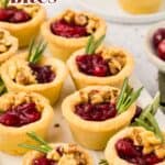 Pinterest image of Keto Cranberry Brie Bites on a white marble tray, with the title in the top left corner.