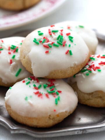 A pile of Keto Ricotta Cookies on a small pewter plate.