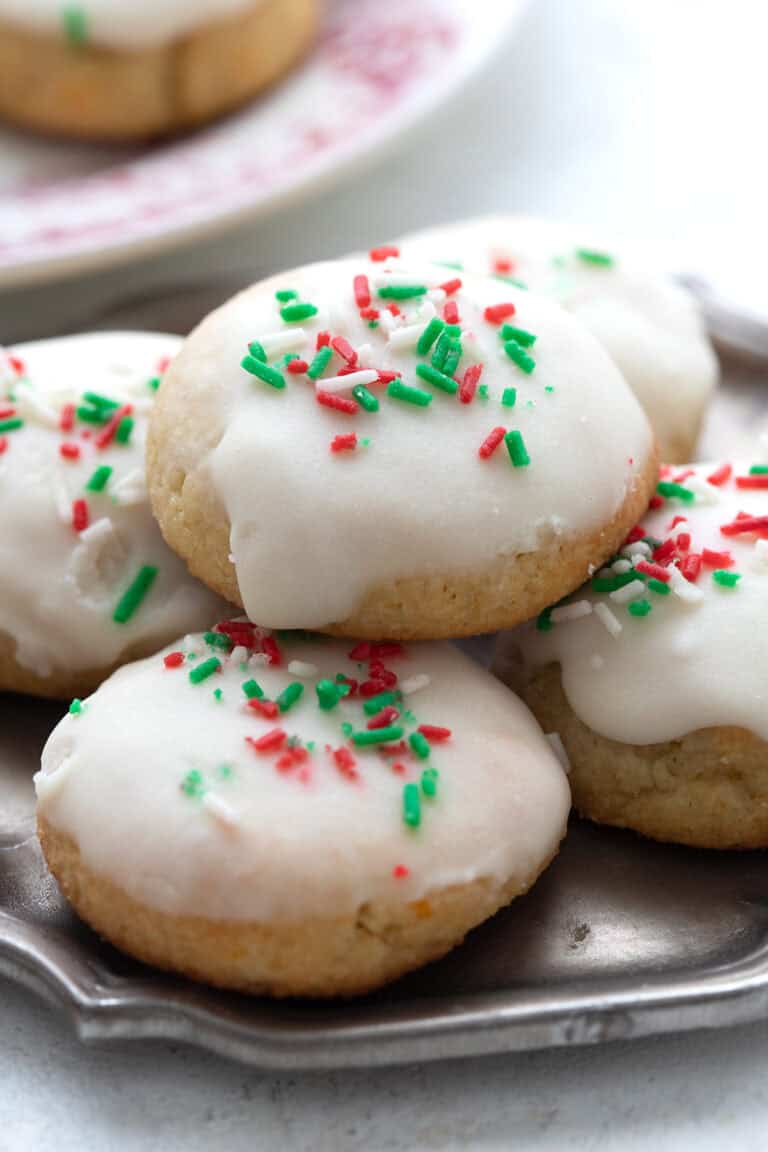 A pile of Keto Ricotta Cookies on a small pewter plate.