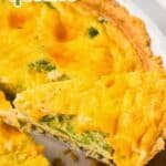 Titled image of a piece of Keto Broccoli Cheese Quiche being lifted out of a white pie dish.