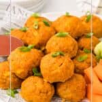 Buffalo Chicken Meatballs piled up on a white plate covered in newsprint, with chopped green onion on top.