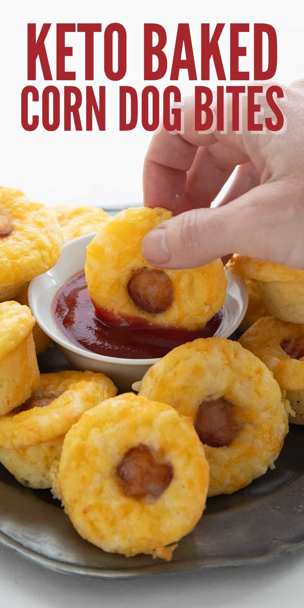 Titled image of a hand dipping a keto corn dog bite into a small bowl of sugar-free ketchup.