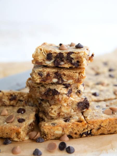 Easy Keto Butterscotch Bars piled up on a piece of brown parchment paper.