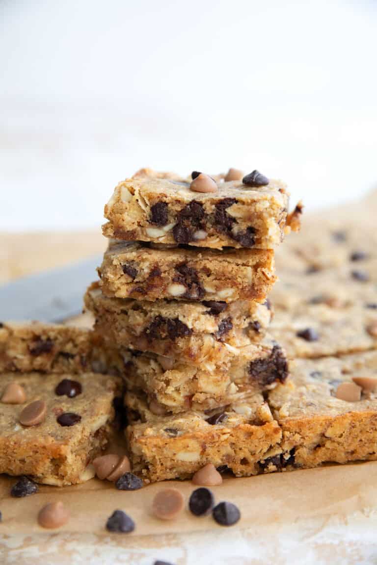 Easy Keto Butterscotch Bars piled up on a piece of brown parchment paper.