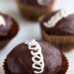 Titled Pinterest image of Keto Hostess Cupcakes on a marble table top.