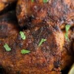 Close up shot of Air Fryer Tandoori Chicken in a black bowl.