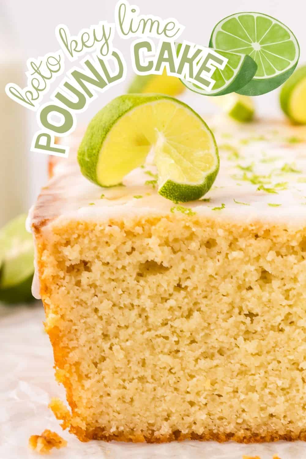 Titled image close up of a loaf of Keto Key Lime Pound Cake with a slice cut out of it and lime slices on top.